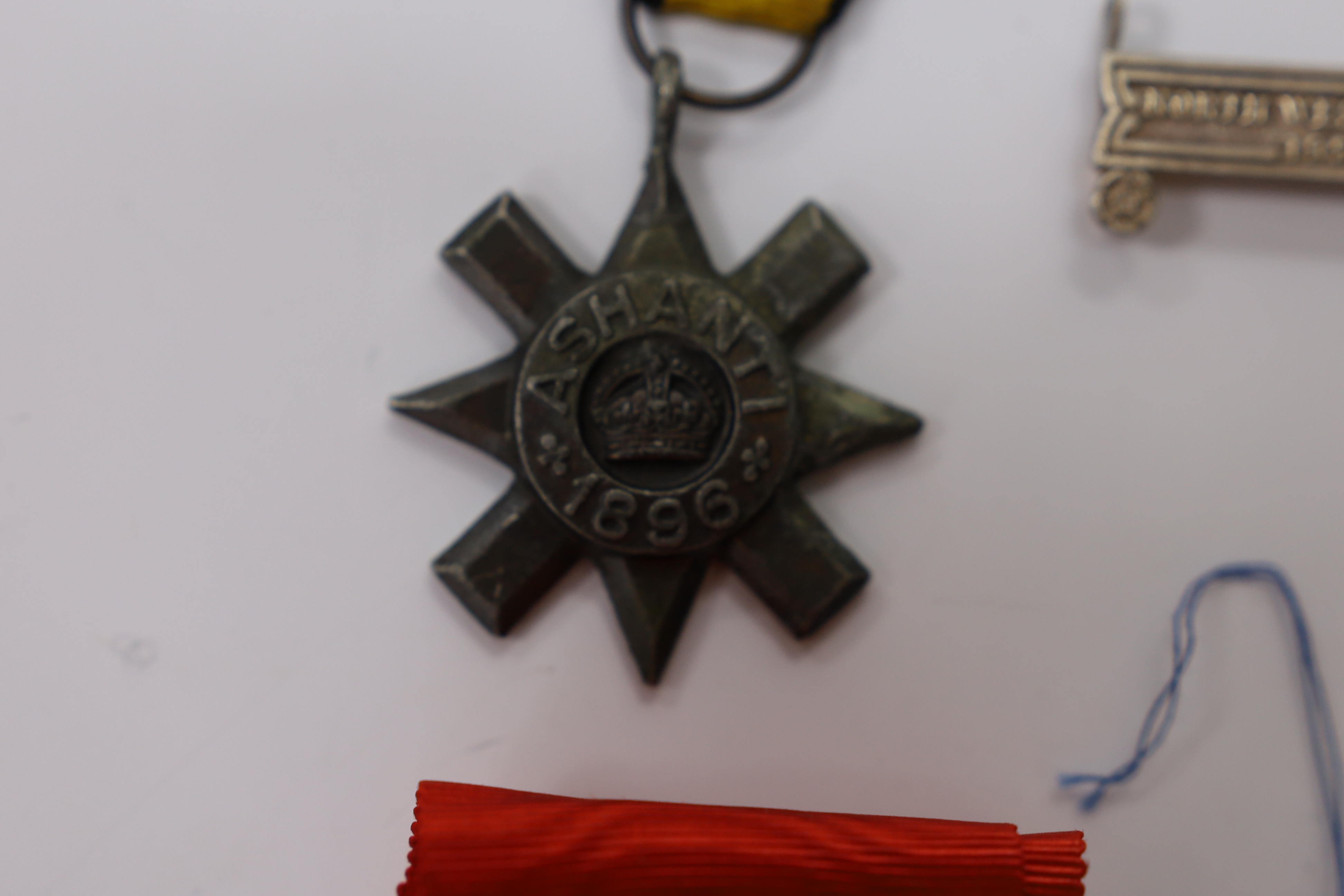 Replica medals; Khedive's Star 1884-6 and another undated; Ashanti star; Spink British North Borneo medal, a loose North West Frontier 1930-31 clasp and a Total Abstinence India medal 50-80